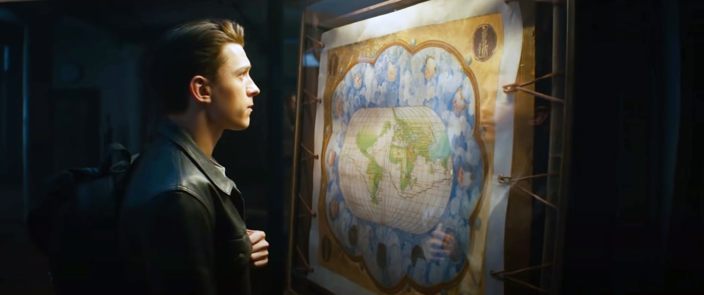 Tom Holland stares at a map.