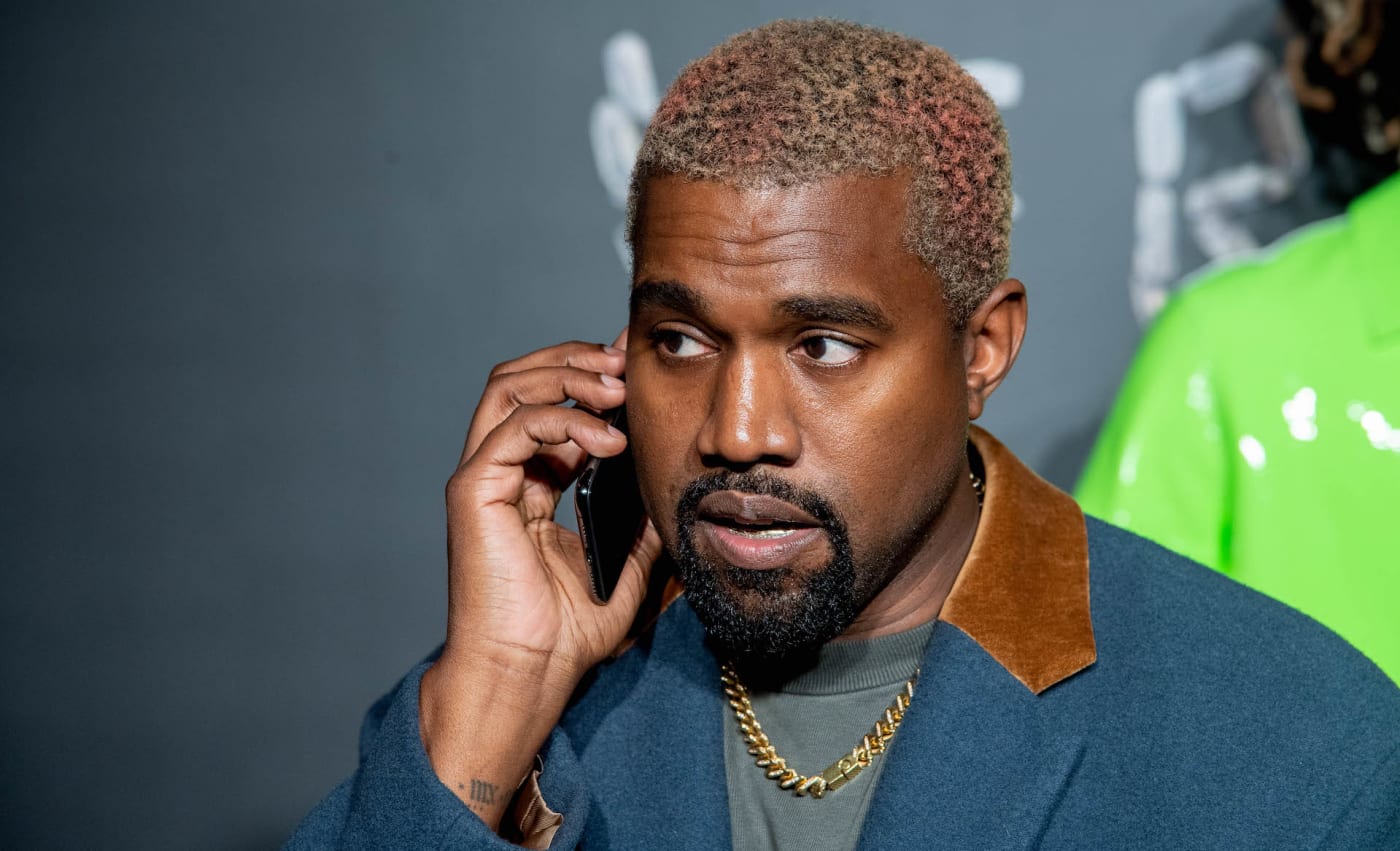 kanye on the phone with a chain