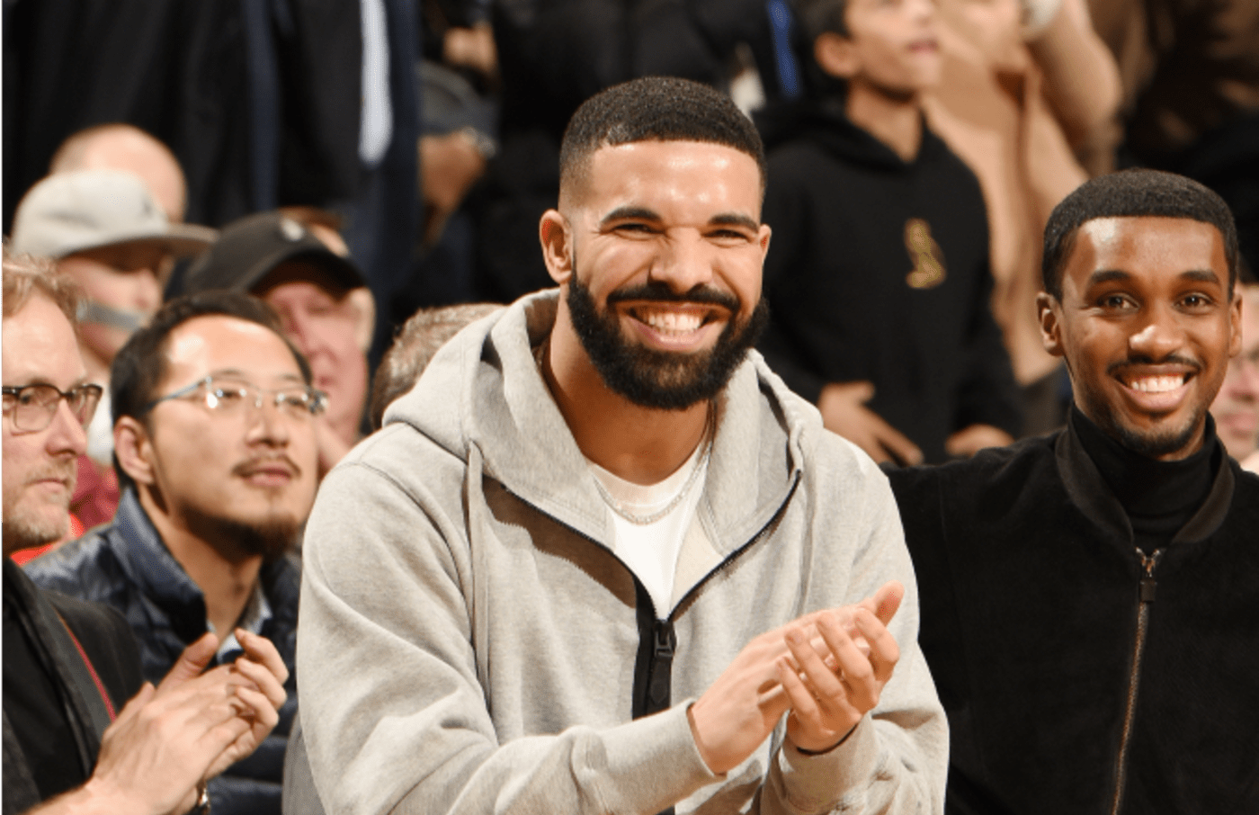 Drake celebrates during the game