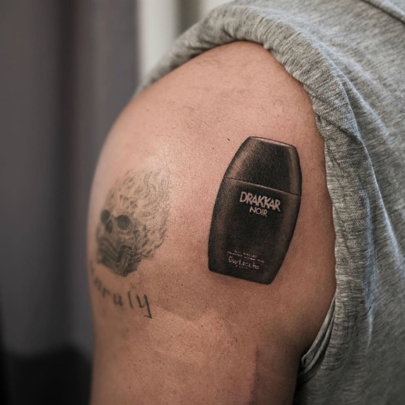 Drake's Drakkar Noir tattoo