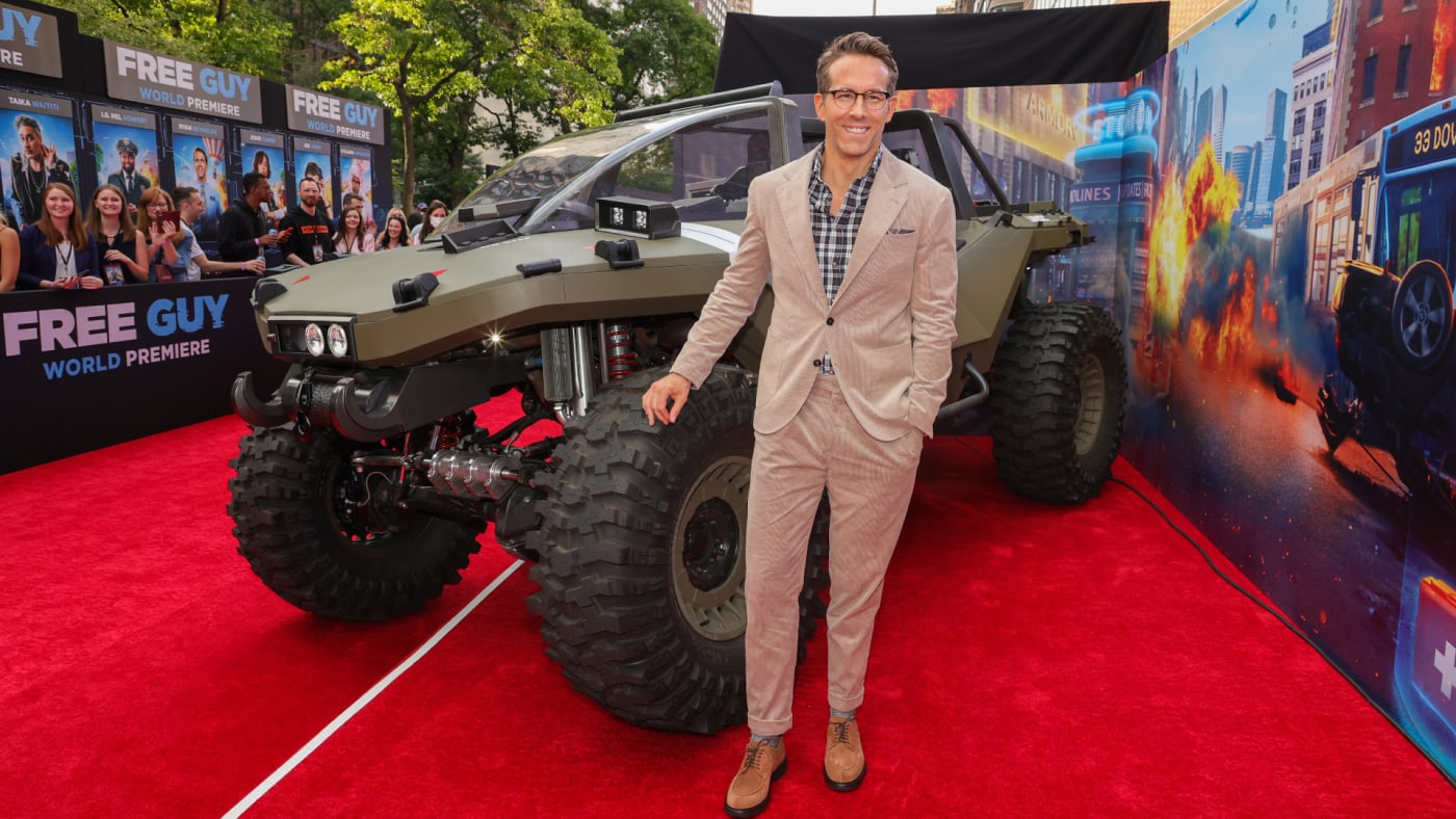 Ryan Reynolds is seen promoting his latest movie on a red carpet.
