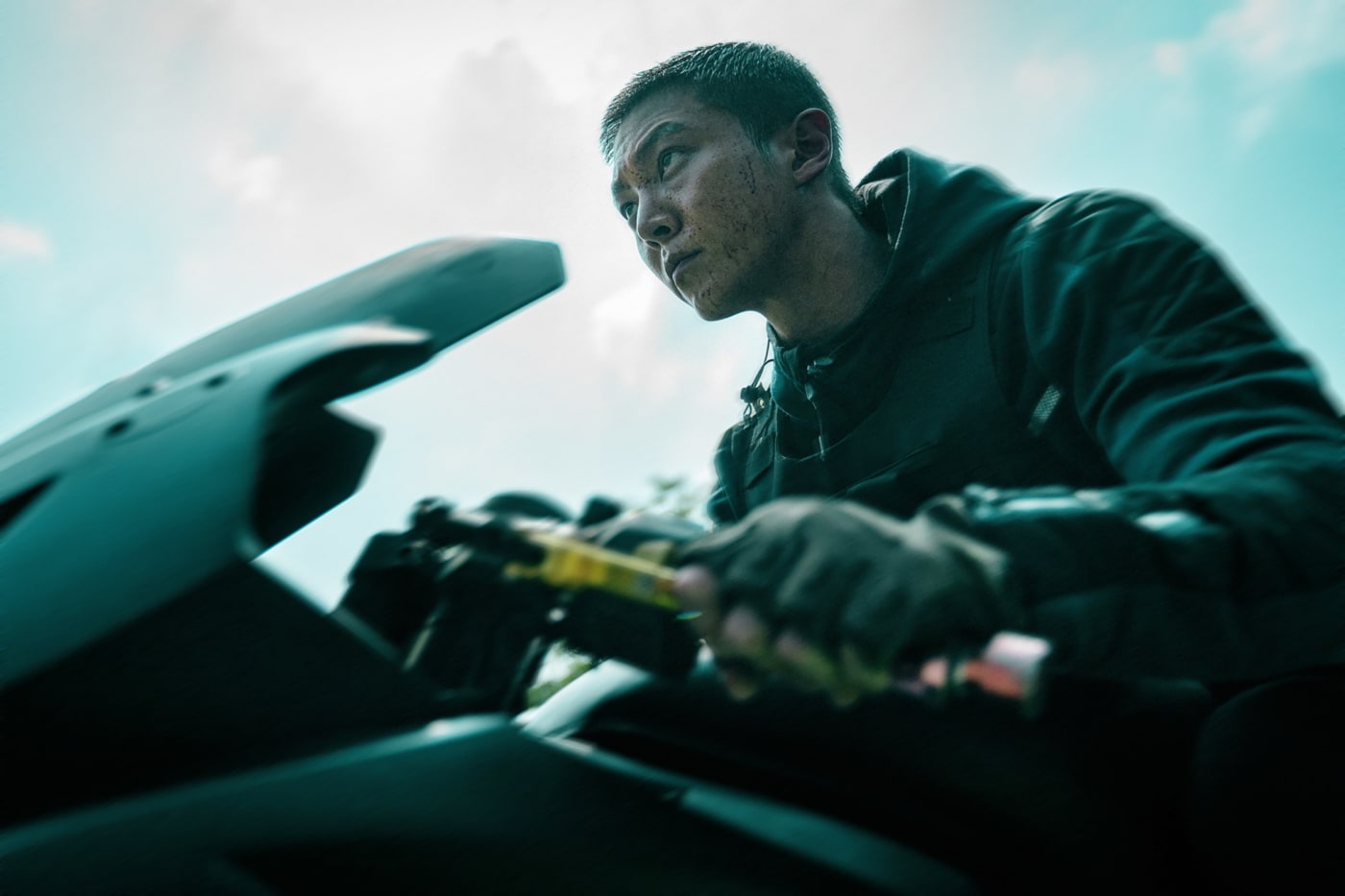 A man is on a motorcycle.