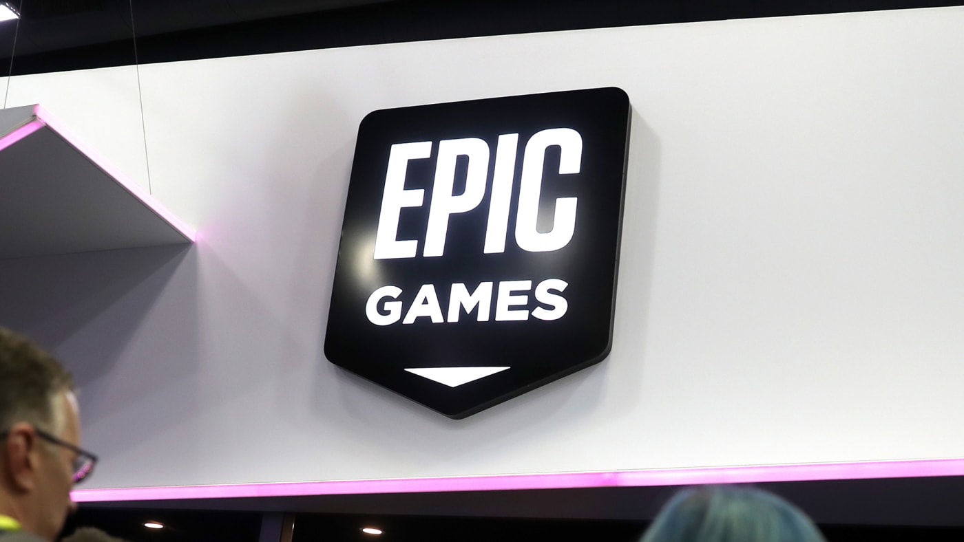 Attendees walk by the Epic Games booth at the 2019 GDC Game Developers Conference on March 20, 2019