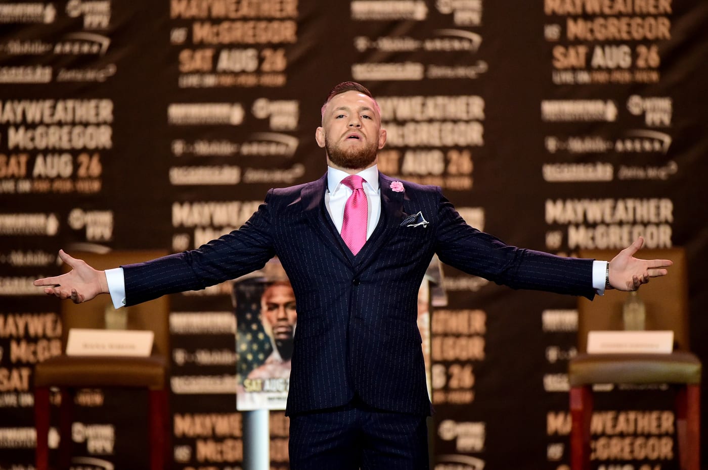 The Story Behind Conor McGregor’s Pinstripe “F*CK YOU” Suit Complex