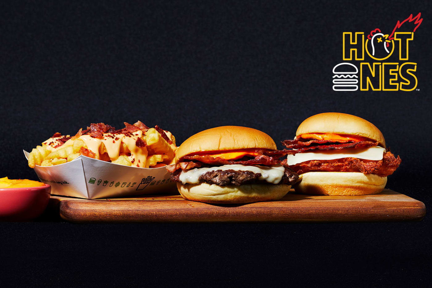 hot ones x shake shack limited edition menu featuring a burger, chicken sandwich, and cheese fries