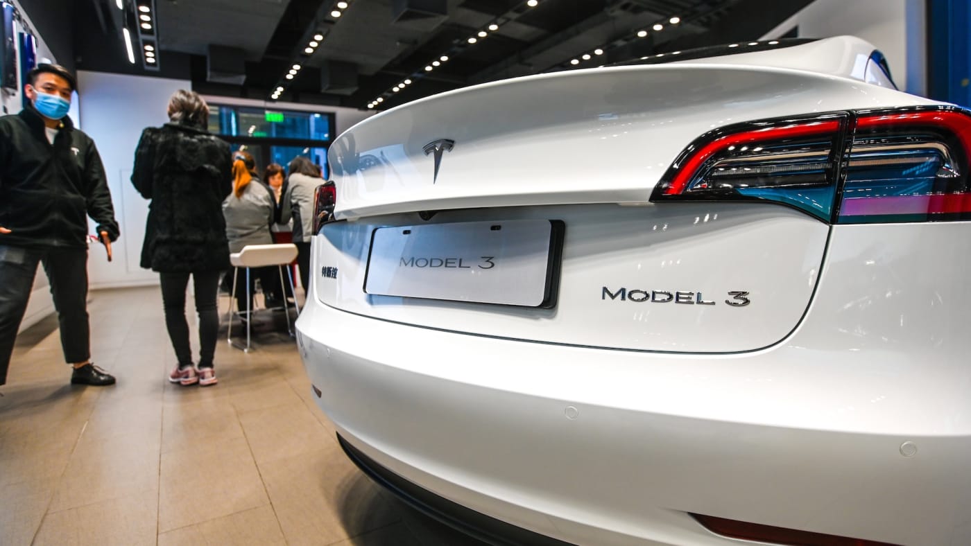 A Model 3 vehicle is seen at a Tesla flagship store