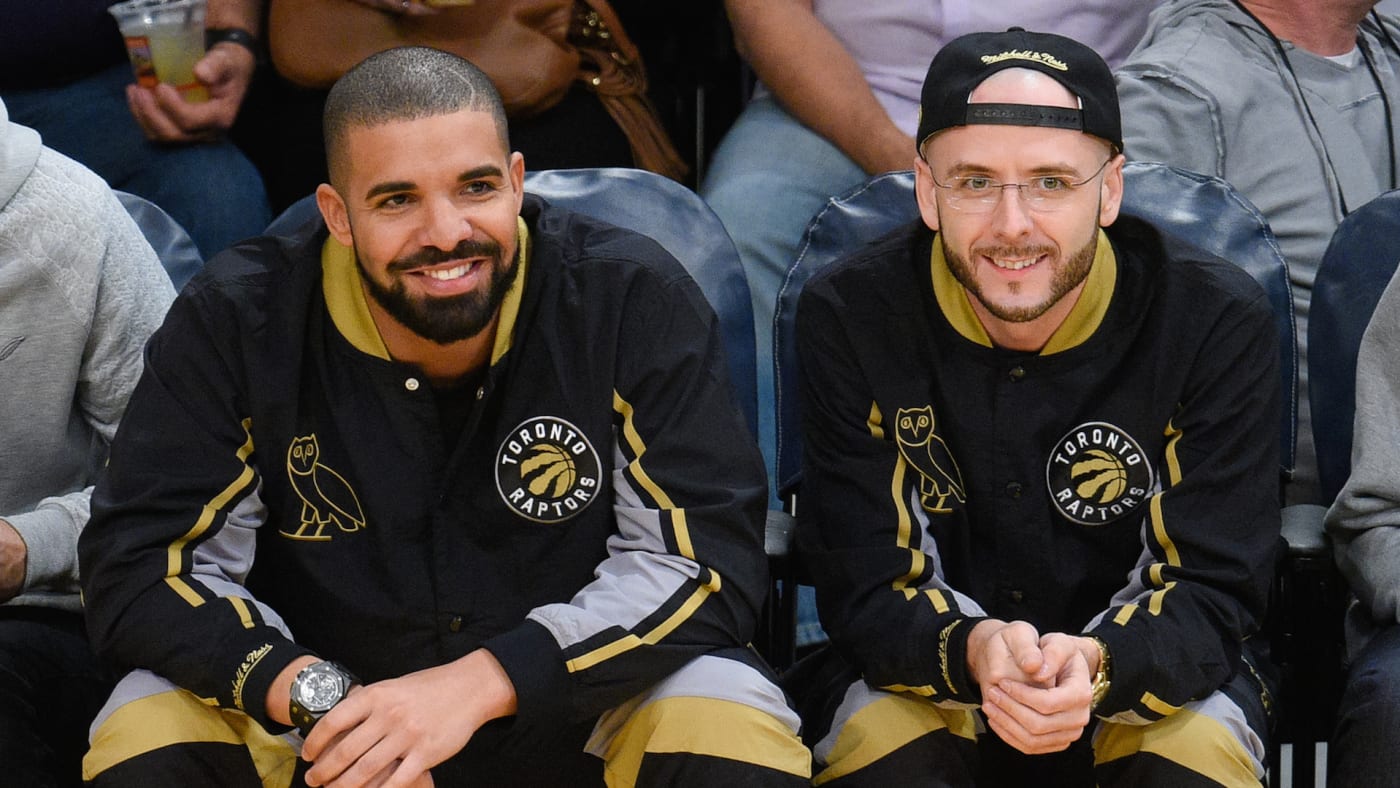 Drake (L) and Noah Shebib attend a basketball game