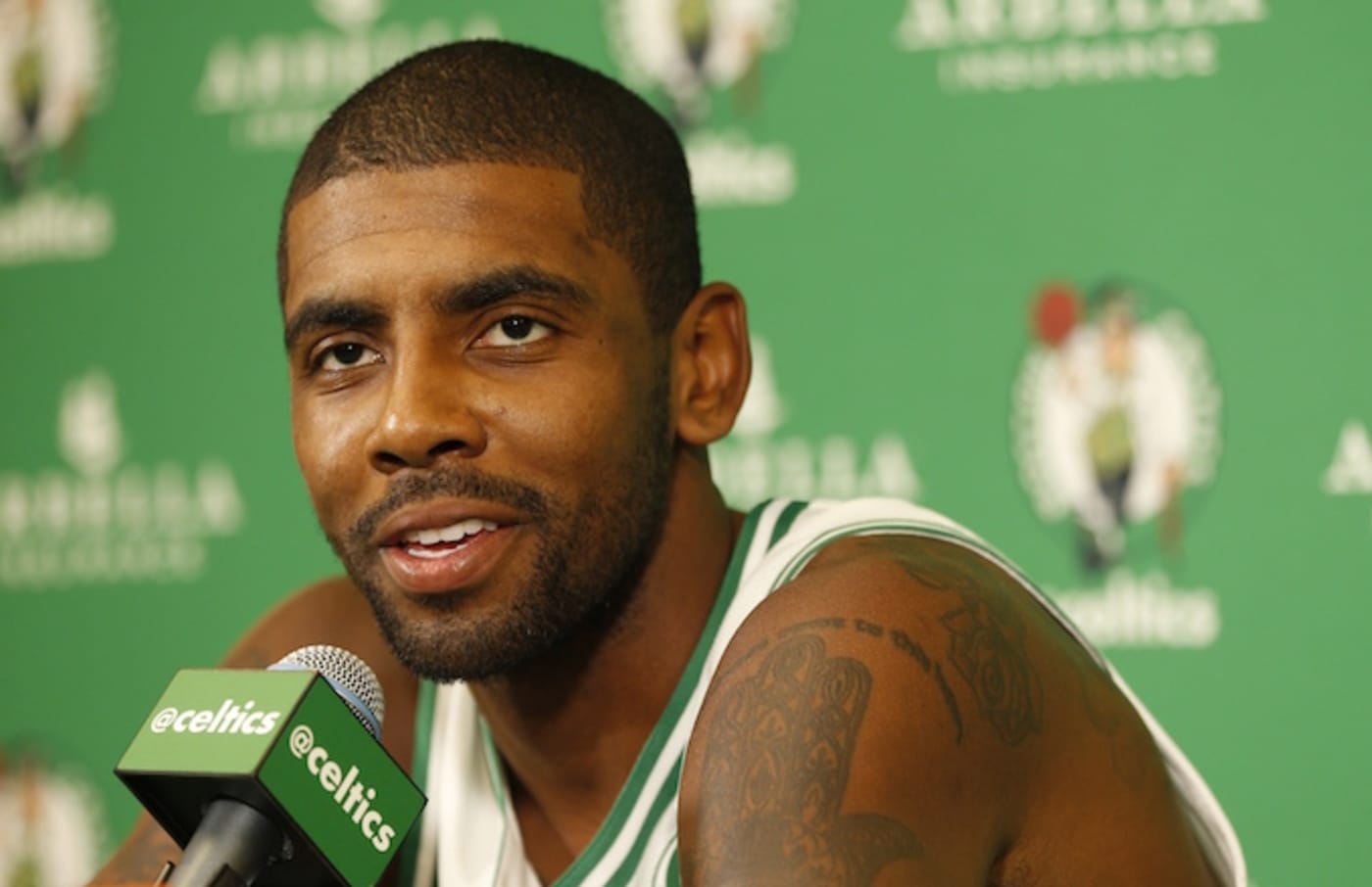 Kyrie Irving talks to the media during media day.
