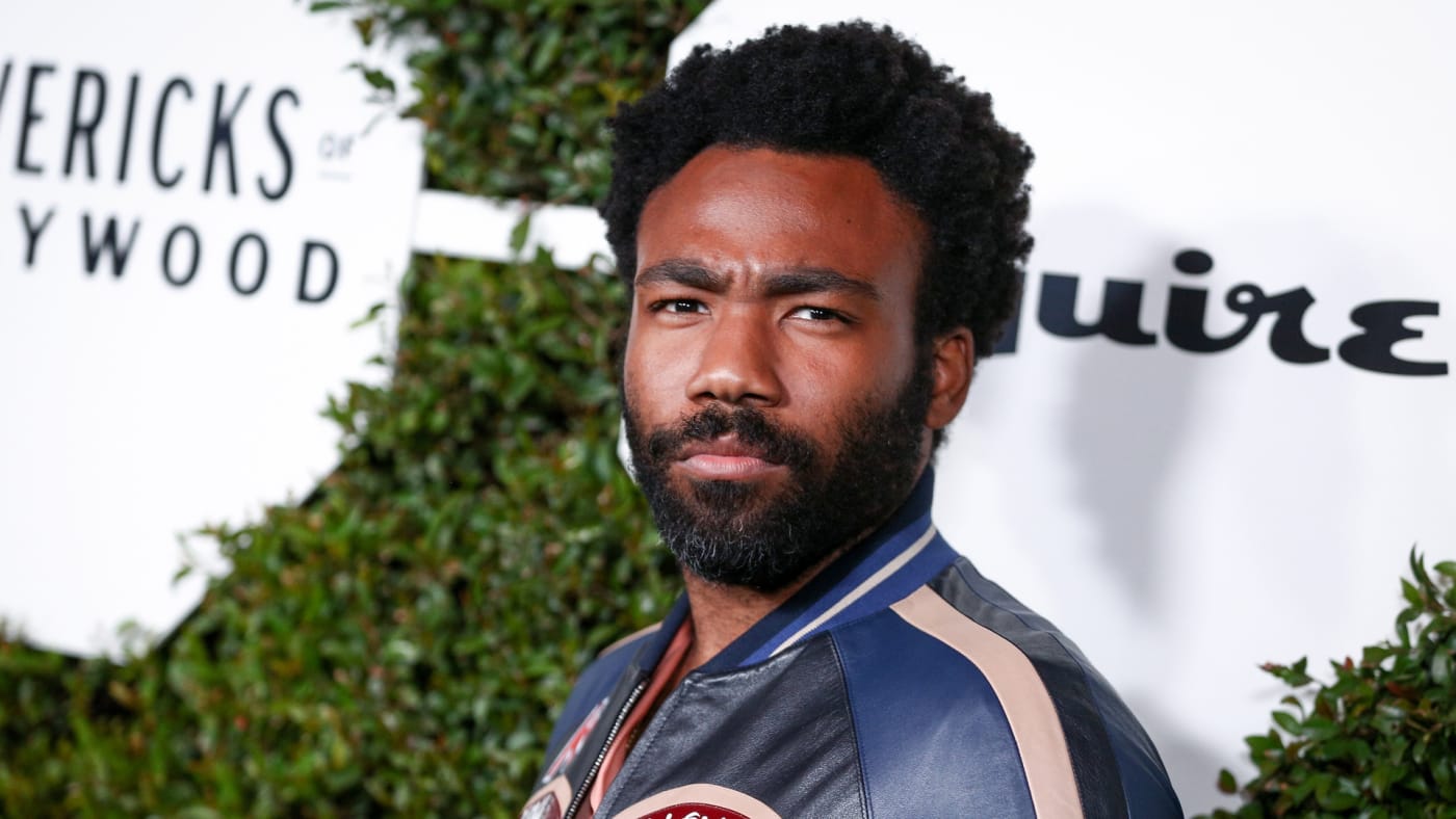 Donald Glover poses for photos at Esquire event.