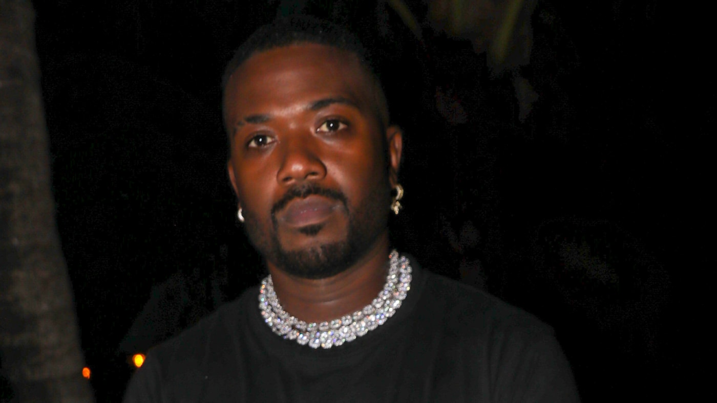 Ray J is seen at an event posing for the camera