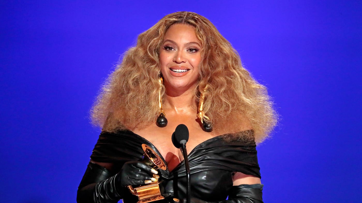 Beyoncé holding a Grammy during the 2021 Grammy Awards ceremony