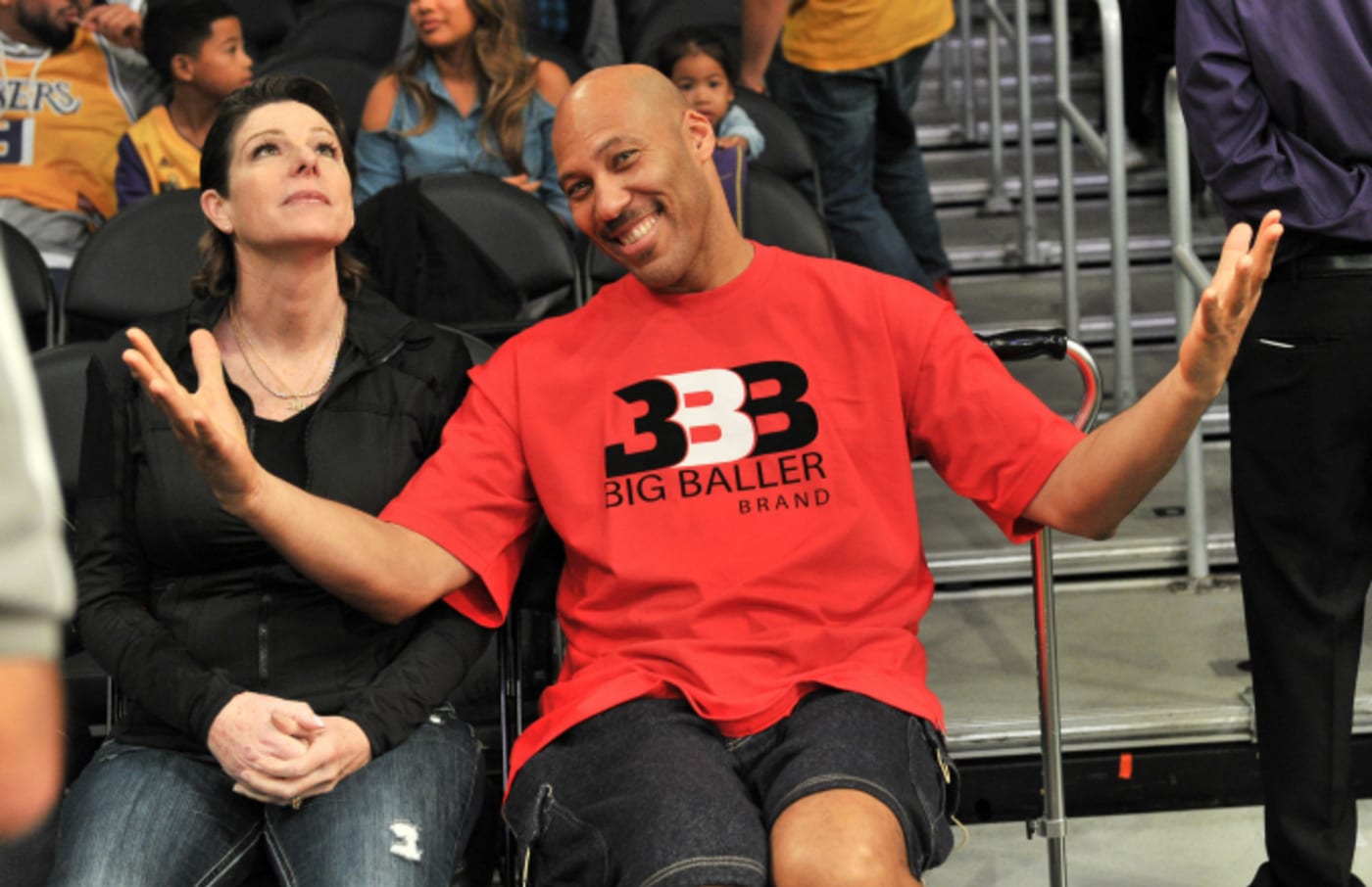 LaVar Ball (R) and Tina Ball attend a basketball game