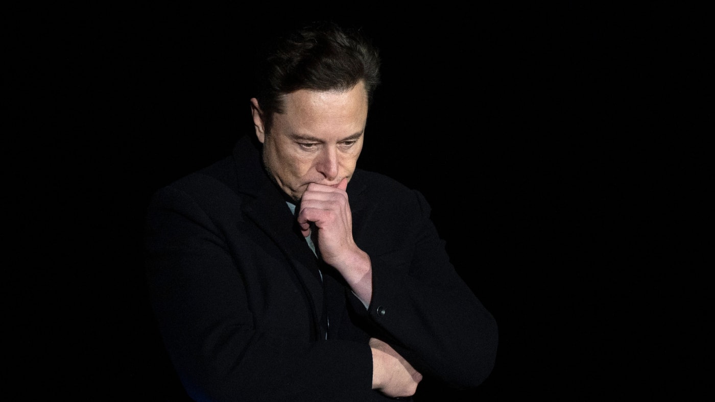 Elon Musk looks down during SpaceX press conference.