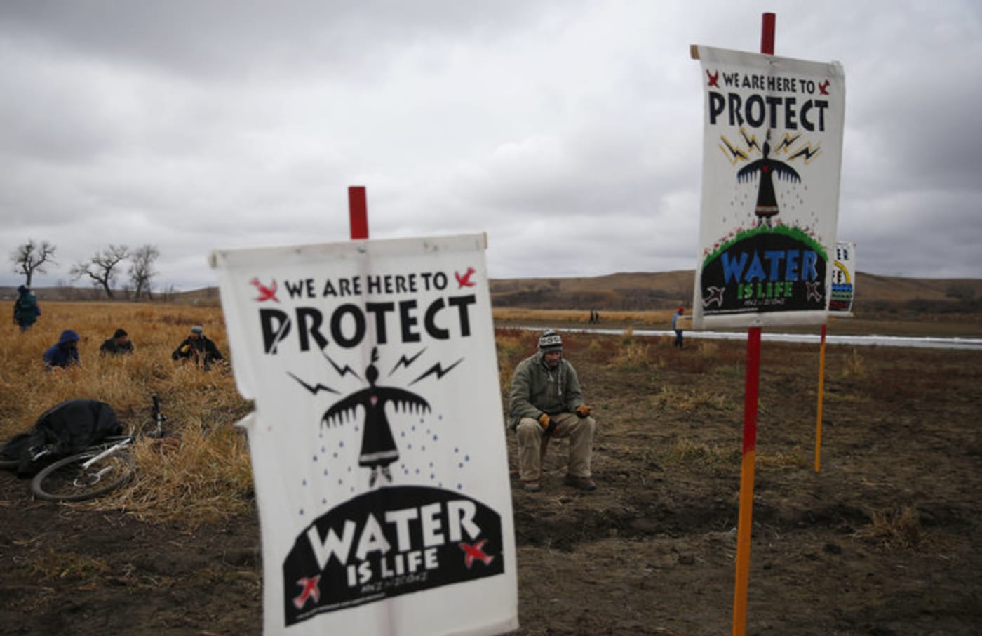 Water protectors protest as police line the hill at Standing Rock on Nov. 24, 2016,