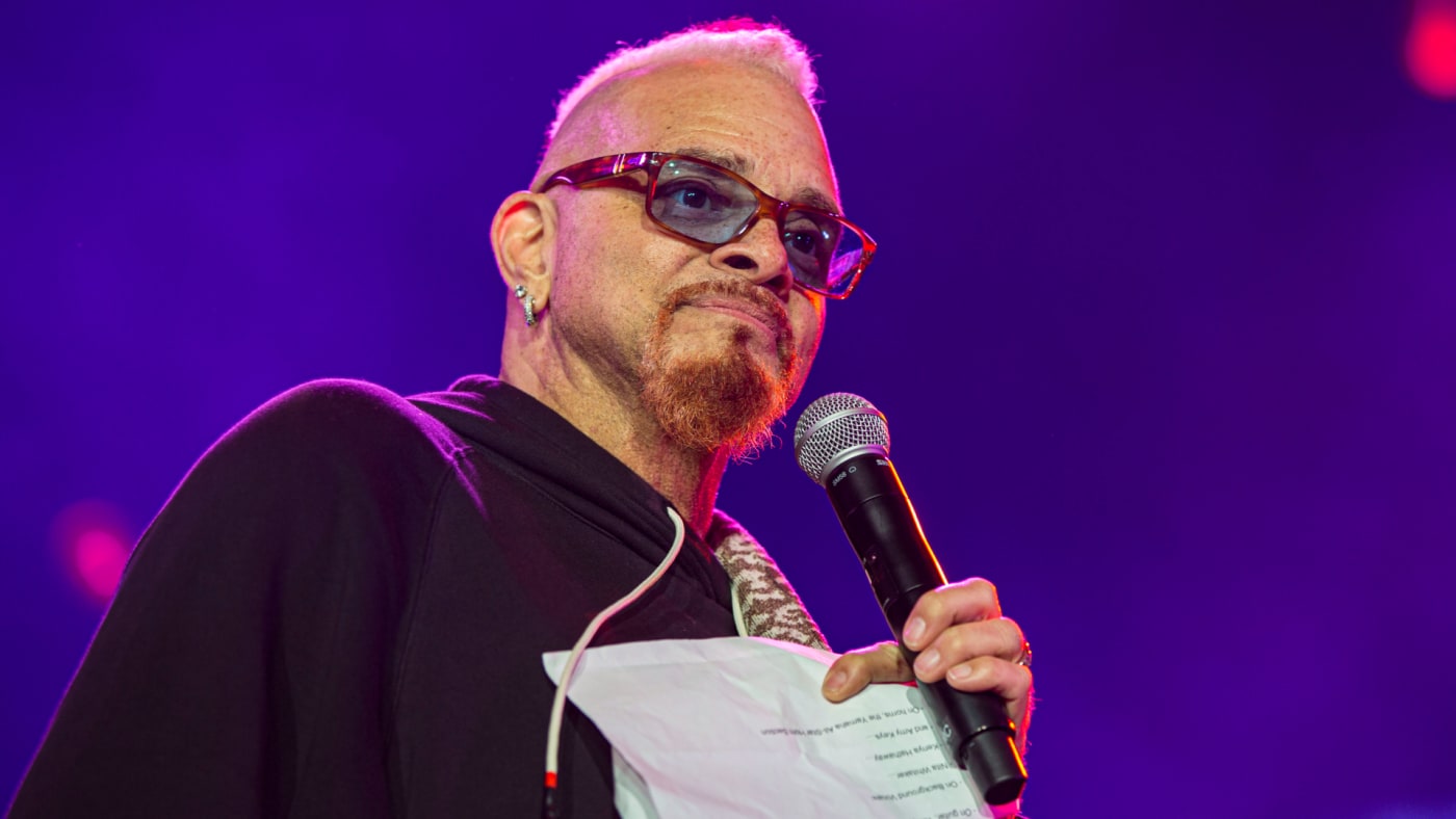 Sinbad is seen speaking to the crowd at a public event