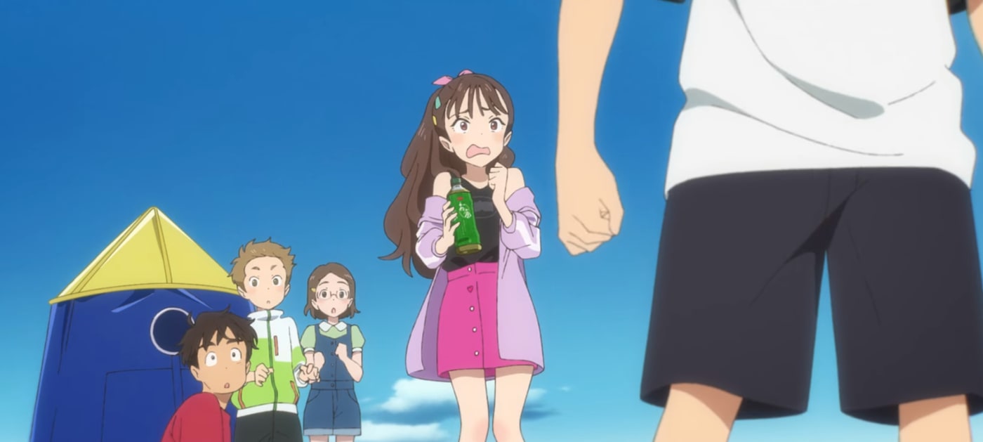 A girl stands frightened with a drink in her hand.