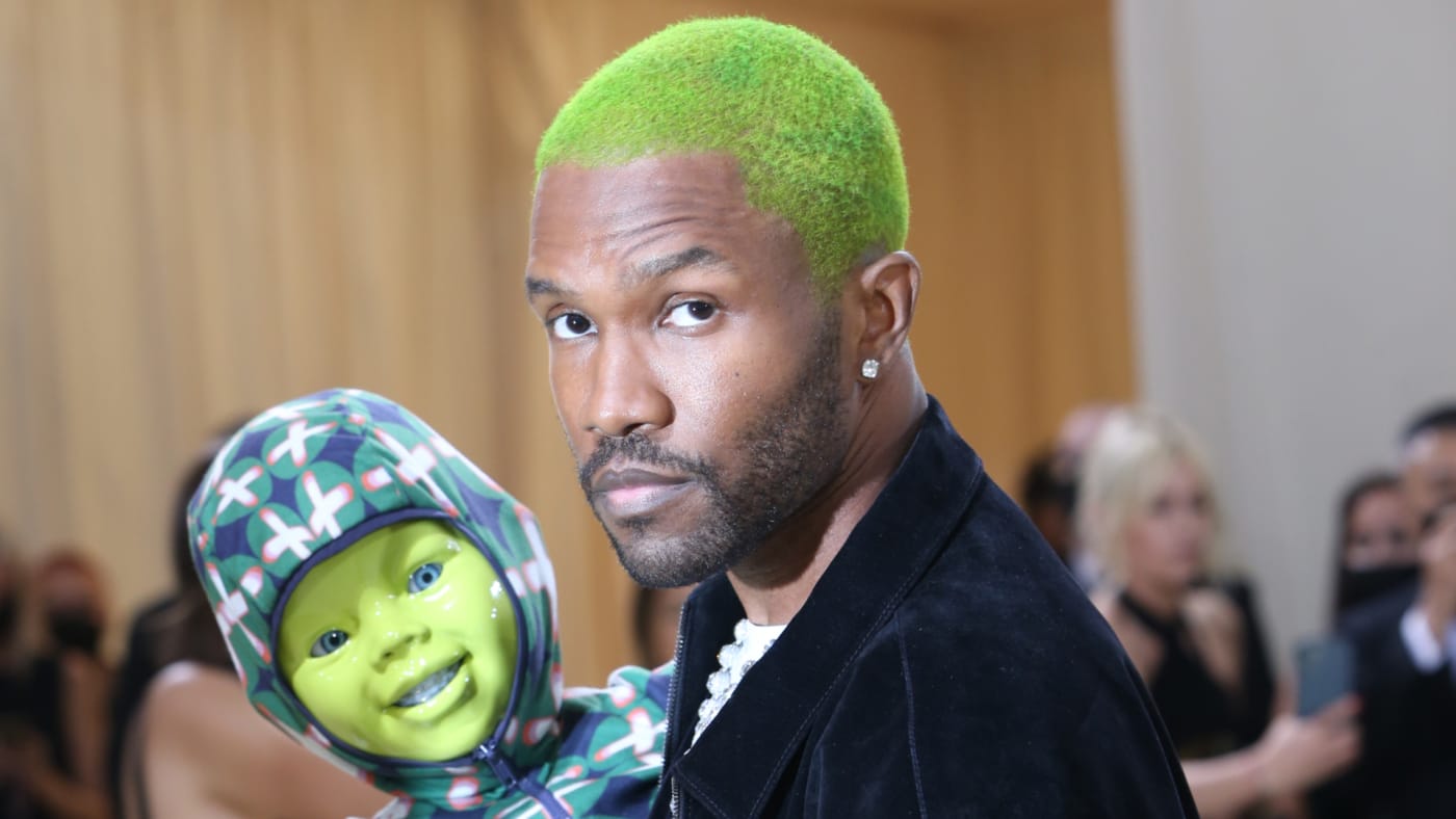 Frank Ocean is seen holding a fake child