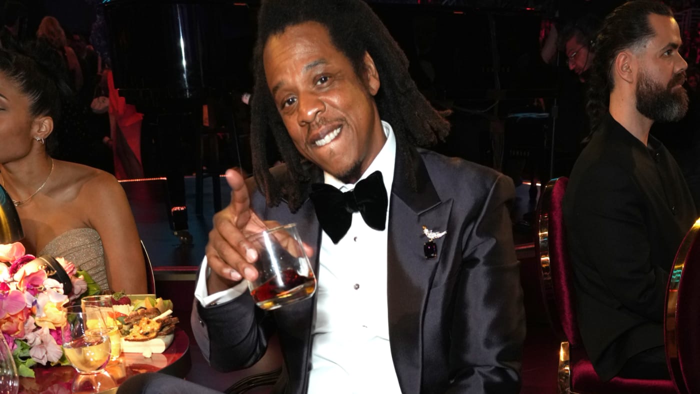 Jay Z is seen holding a glass
