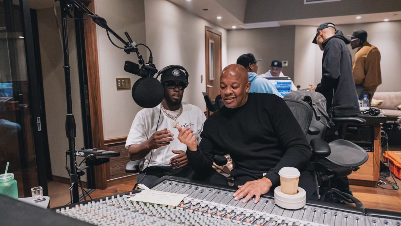 Dr. Dre and Diddy pictured in the studio together.