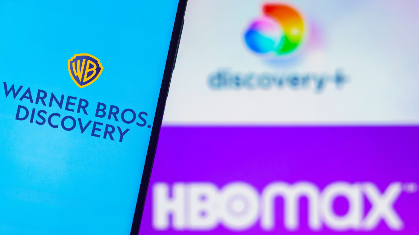 Warner Bros. Discovery logo is displayed with the HBO Max and Discovery Plus logos.
