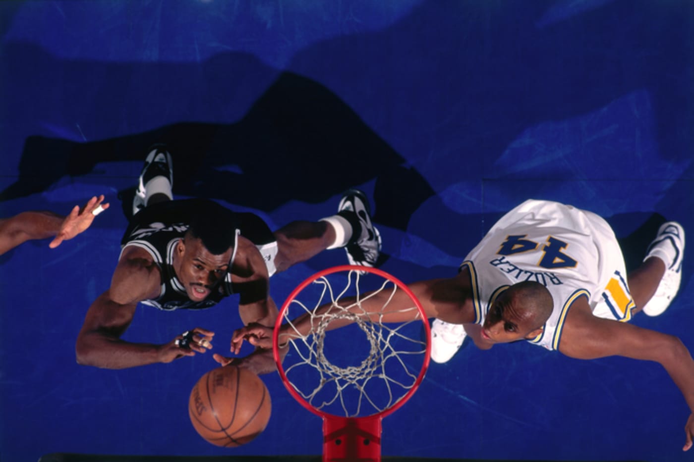 David Robinson of the San Antonio Spurs and Clifford Rozier of the Golden State Warriors circa 1996