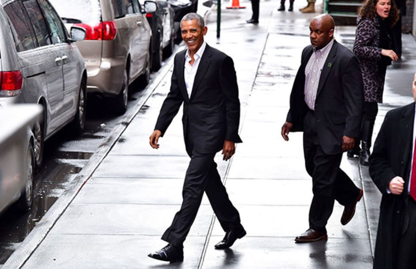 Barack Obama walking to his car in New York City.