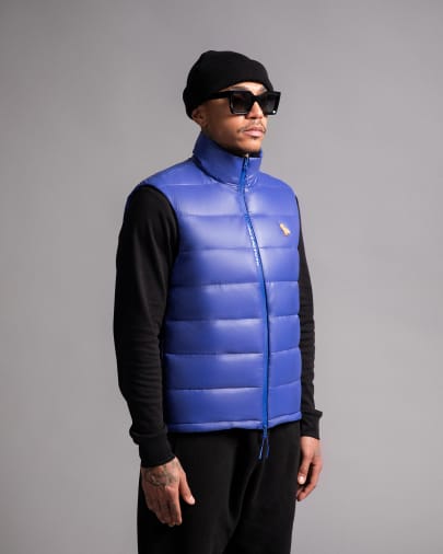 Model in blue puffer vest -
