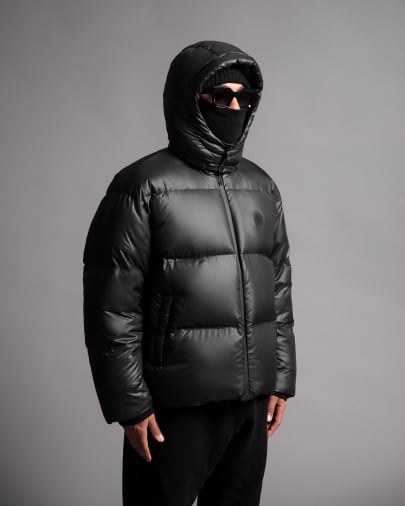 Model in shiny black puffer jacket  - OVO Drake