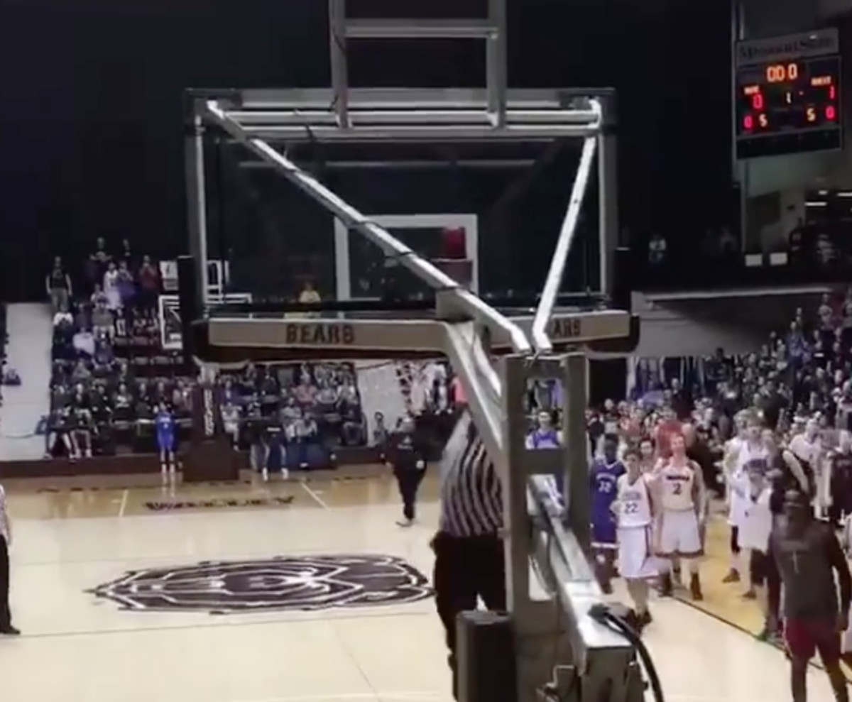 High School Basketball Referee Shuts Down Gym With Windmill Dunk Complex