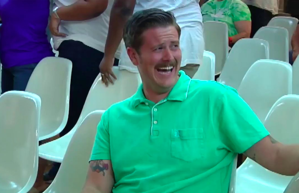 Handsome African Man Laughing Out Loud At Funny Meme Or Joke He