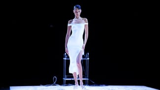 Bella Hadid is dressed by spraying foam during the Coperni SpringSummer 2023 fashion show