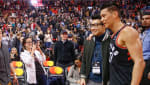 Raptors team photographer Ron Turenee snaps a photo of Simu Liu and Jeremy Lin