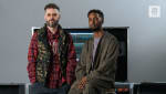 Noah "40" Shebib and Yonis Hassan, of the Justice Fund, pose in front of a mobile studio