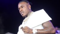 DaBaby performs in front of a crowd.