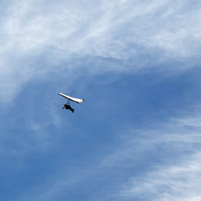 Watch This Hang Glider Hold Onto His Instructor After Not Being