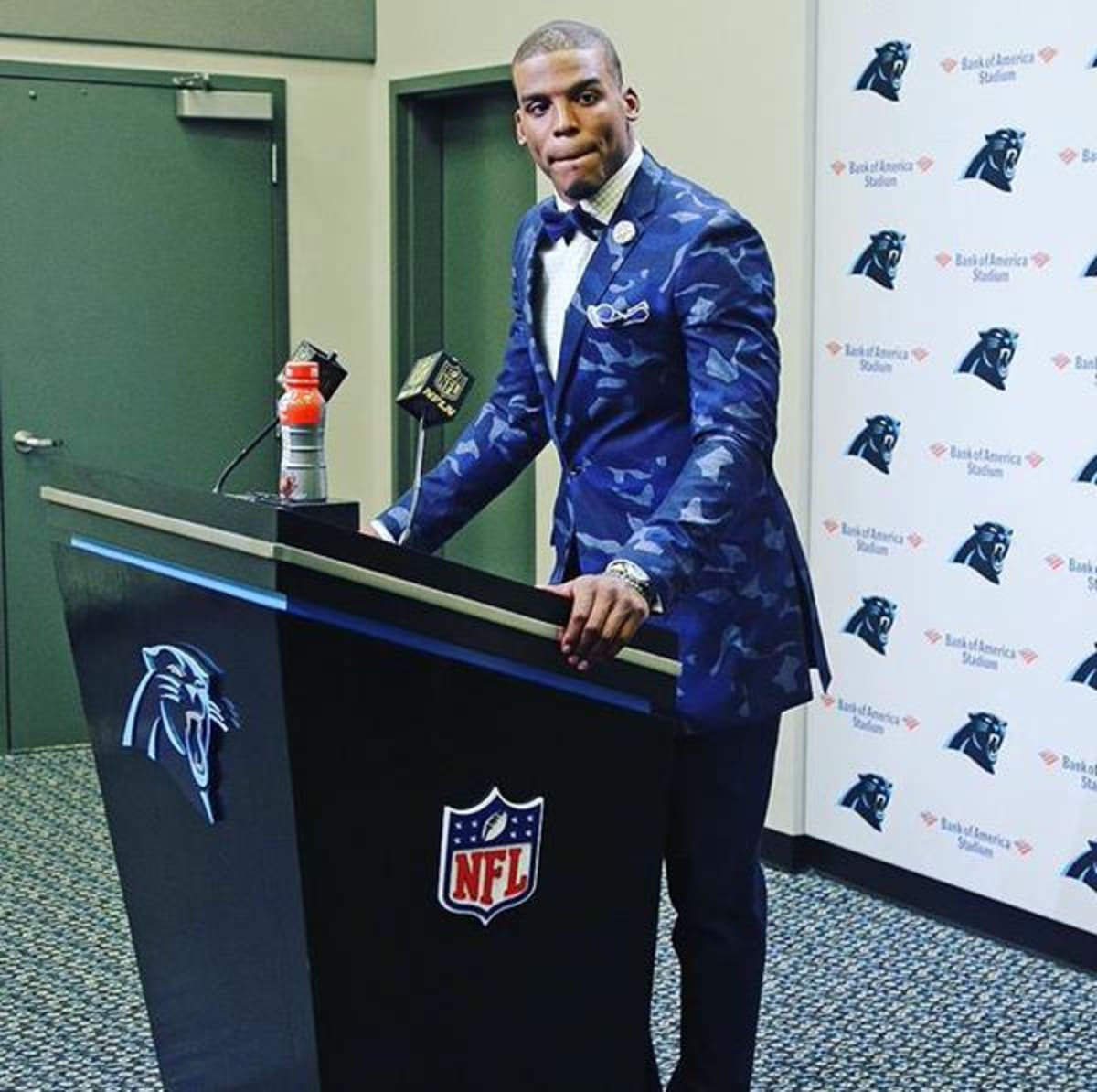 Cam Newton Rocks a Camo Suit Jacket at a Press Conference