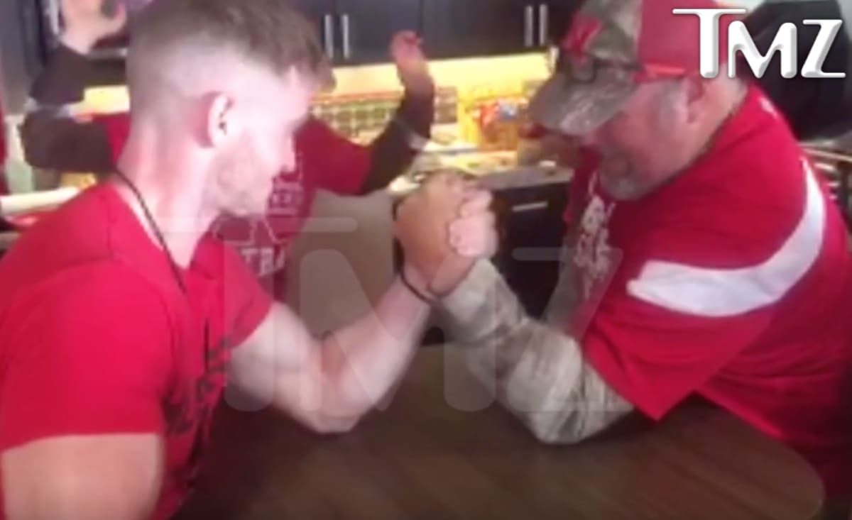 Video Larry the Cable Snaps Guy's Funny Bone During ArmWrestling