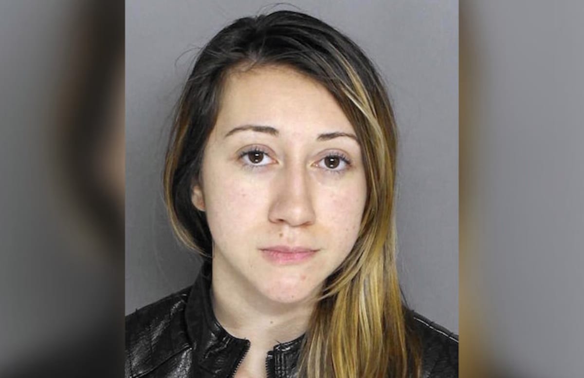 Woman pleads not guilty to posing nude at Catholic school