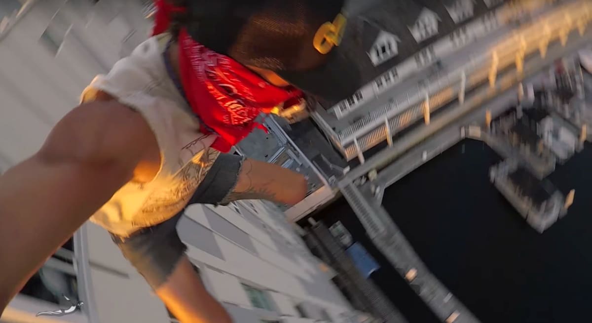 Terrifying Viral Video Shows Dude Jumping Off 8Story Building and