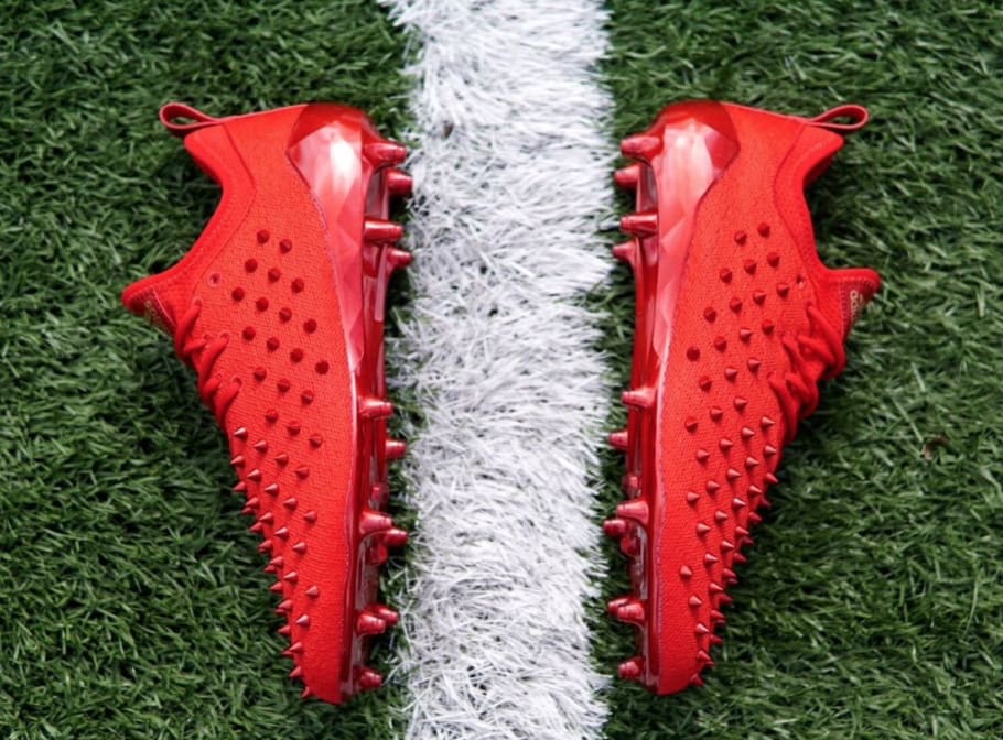 red adidas football cleats with spikes